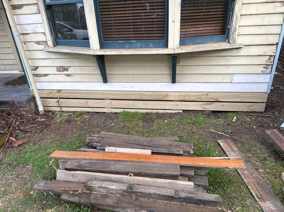 Fresh boards let into the wall below the window, the old timber removed