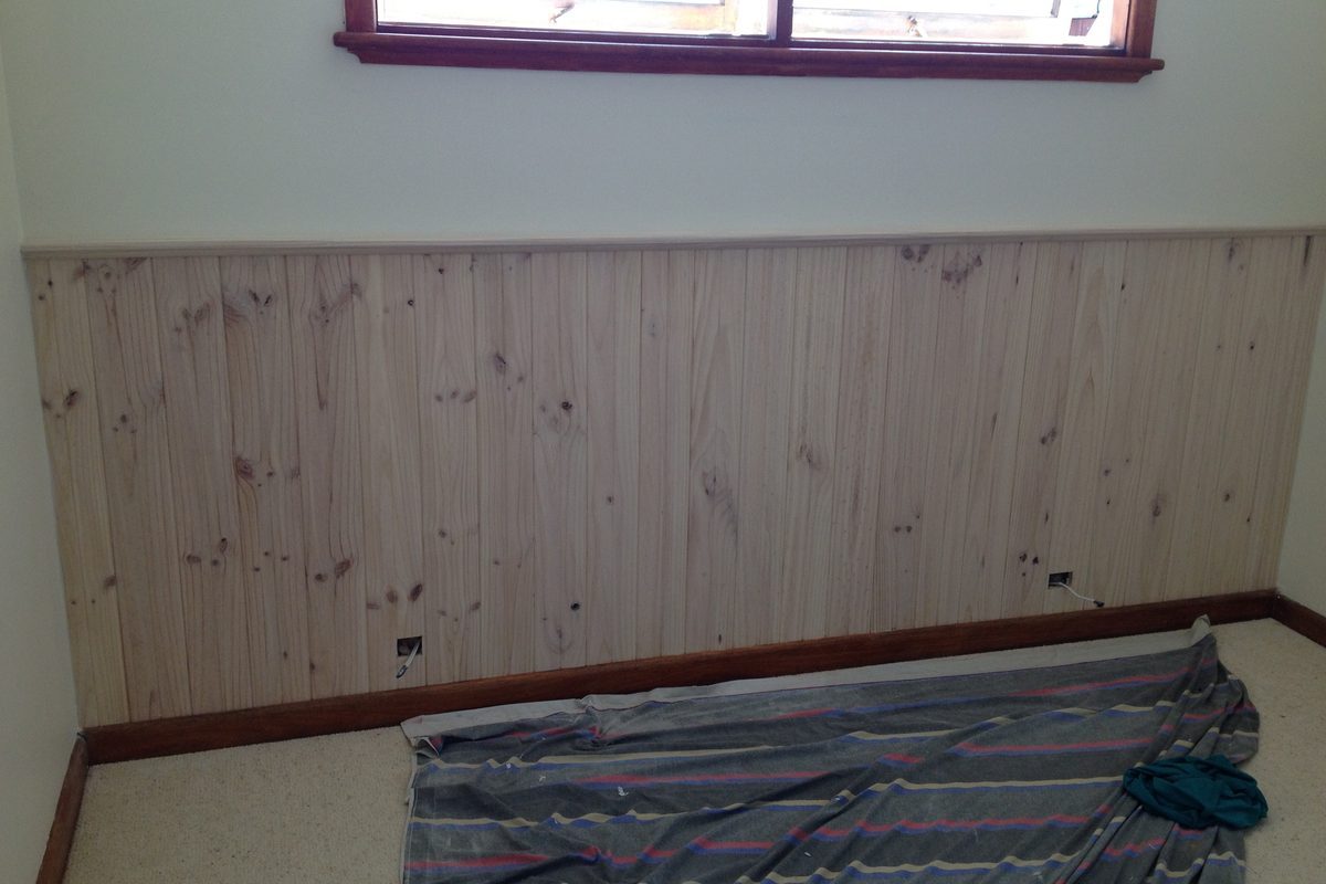 New timber lining boards fitted below a window
