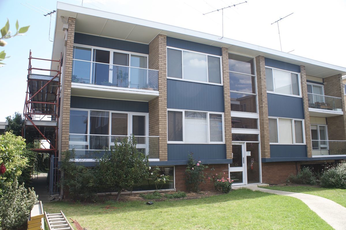 Unit block re-clad in Axon cladding and painted blue-grey