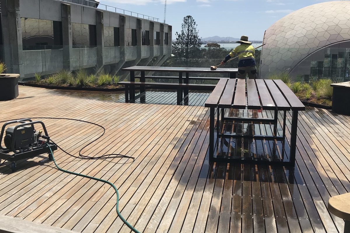 A large timber deck being washed back before recoating