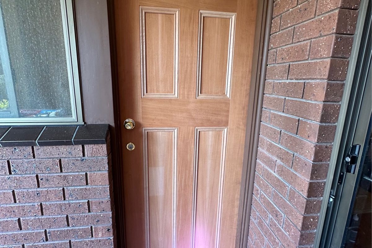 New solid-core panel door fitted to a back entry by JFM