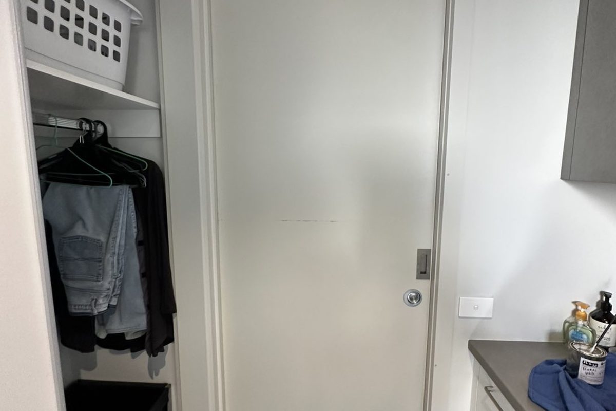 Cavity slider door in a laundry, adjusted so it no longer scrapes