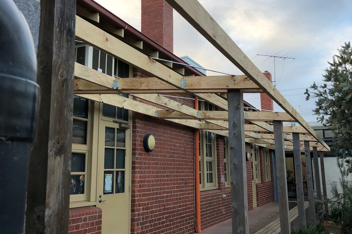 Timber walkway pergola along a school building