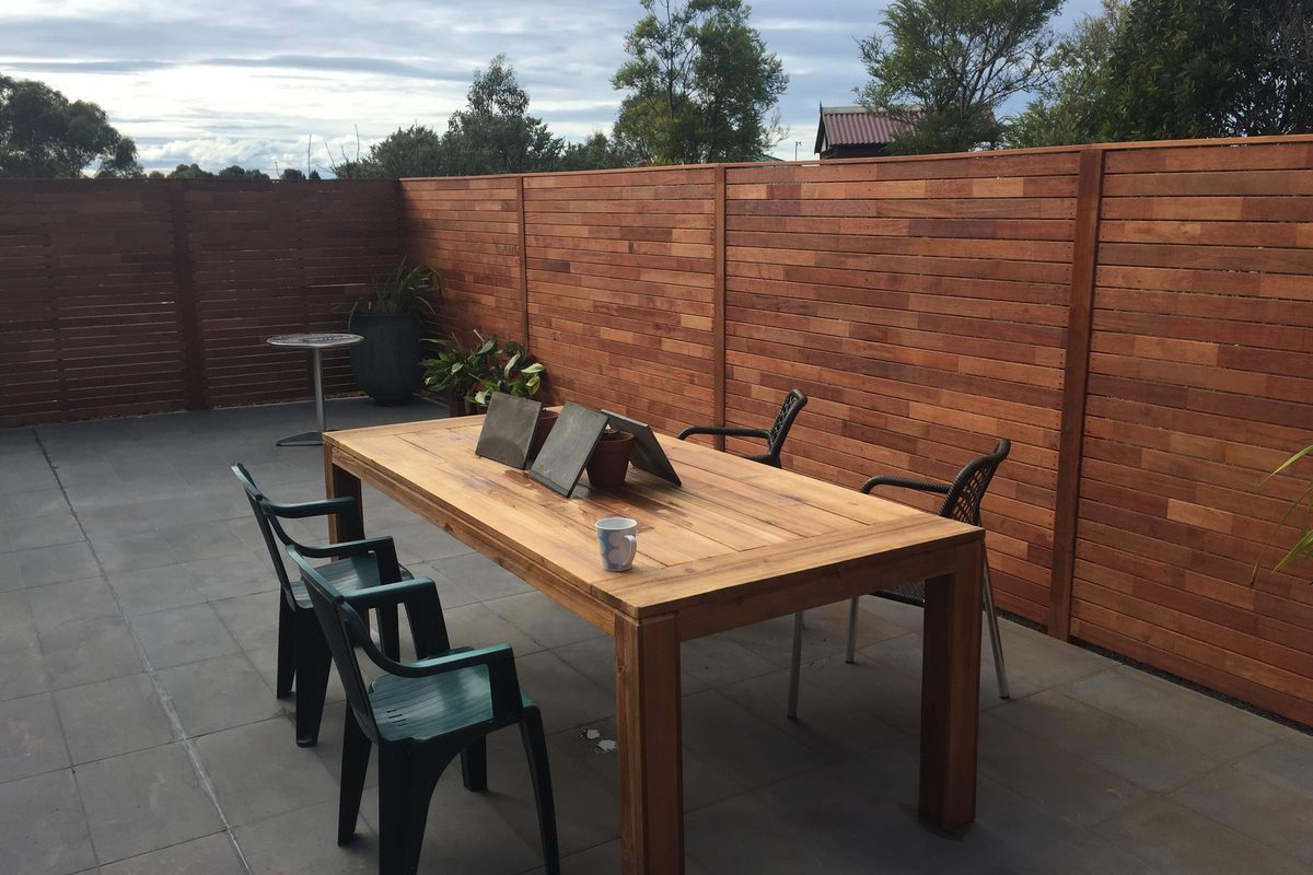 Merbau privacy screens around a concrete patio