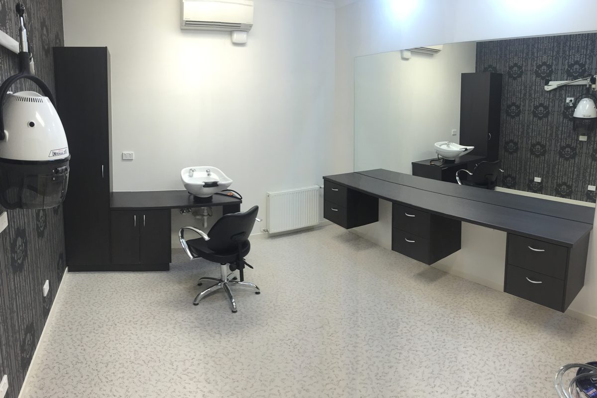 Salon fit-out with styling stations, a basin unit and storage, installed by JFM