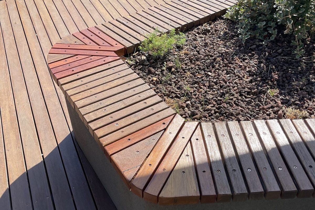 Timber verandah beside a backyard pool