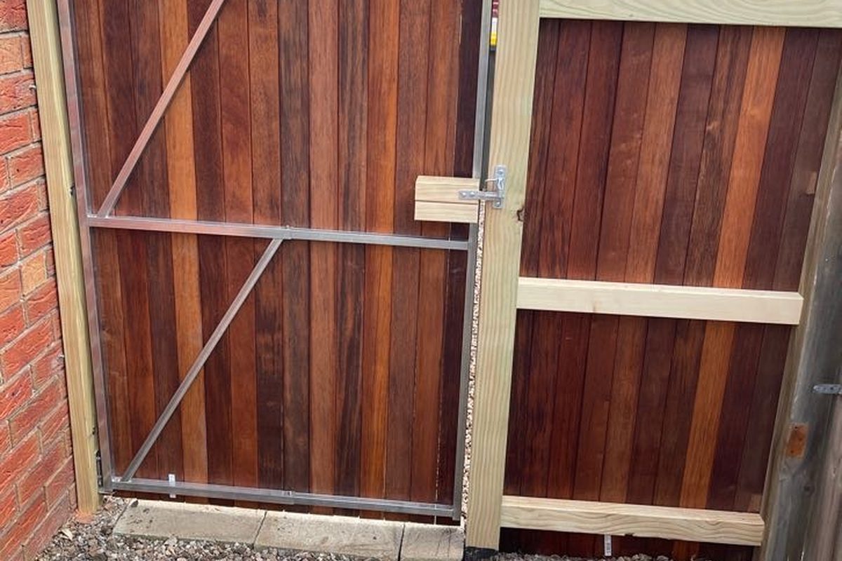 Steel-framed side gate clad in merbau boards, built by JFM in Highton