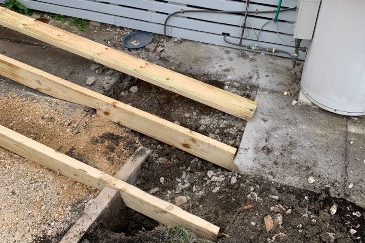 Treated pine frame going in for a timber ramp beside a house in Corio