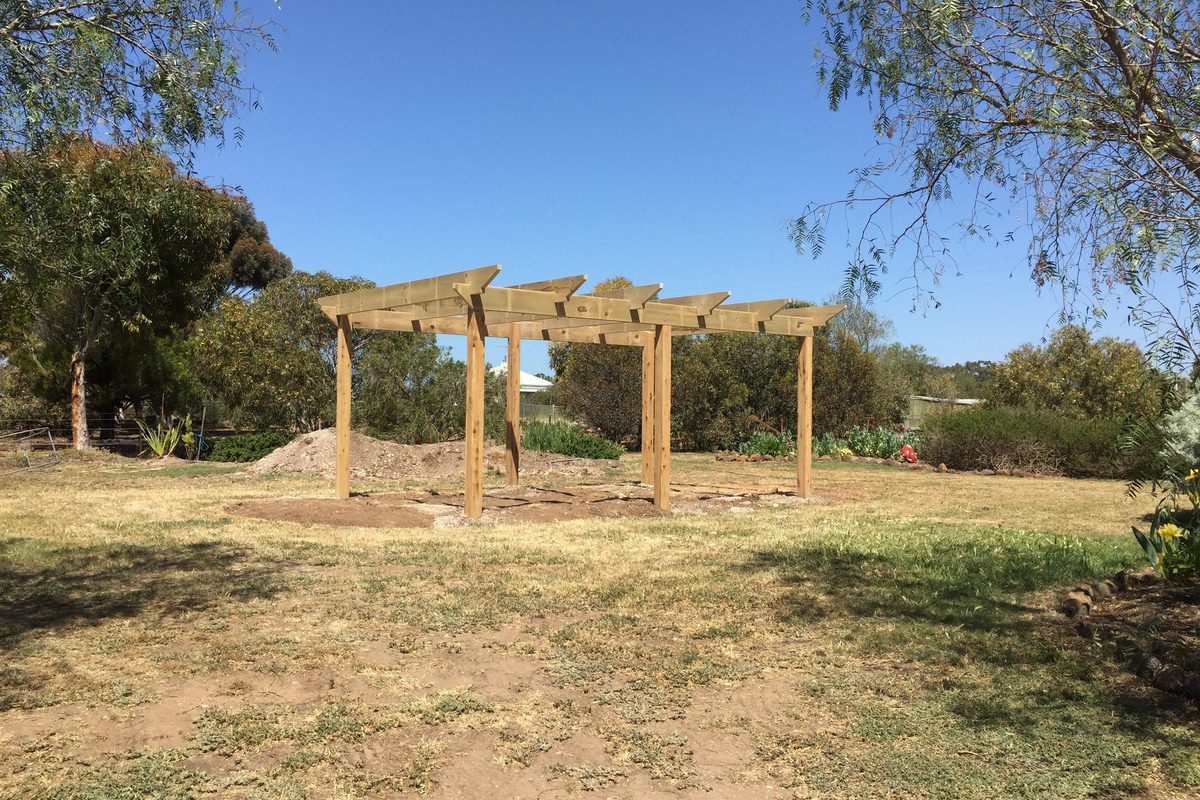 Freestanding open pergola in treated pine on a large open block, built by JFM