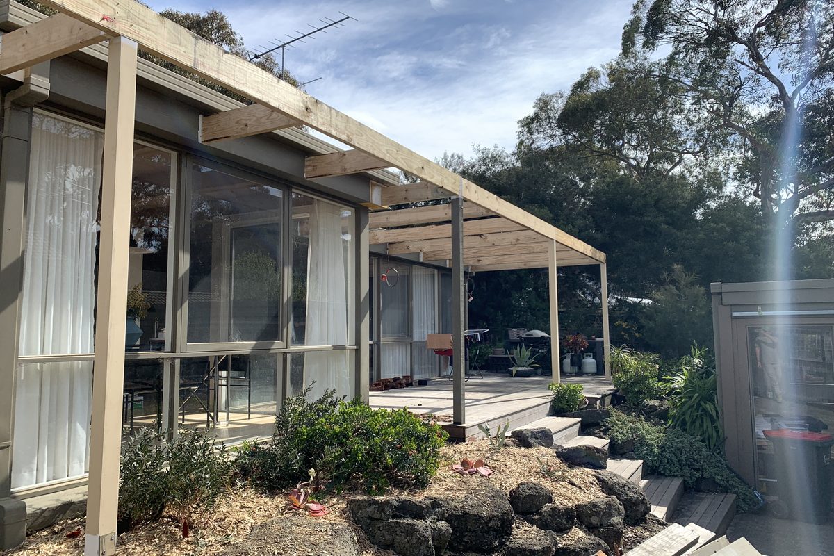 Shade-battened pergola running along the front of a house, built by JFM