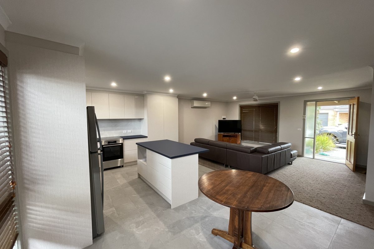 Kitchen, dining and living area opened into one room after the wall came out