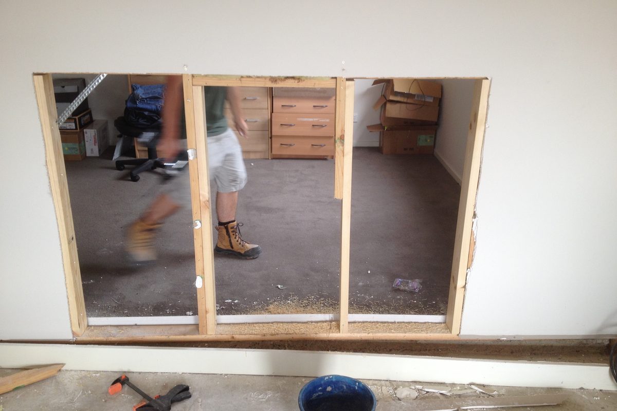 Wall sheeting removed and a new opening framed up during the job