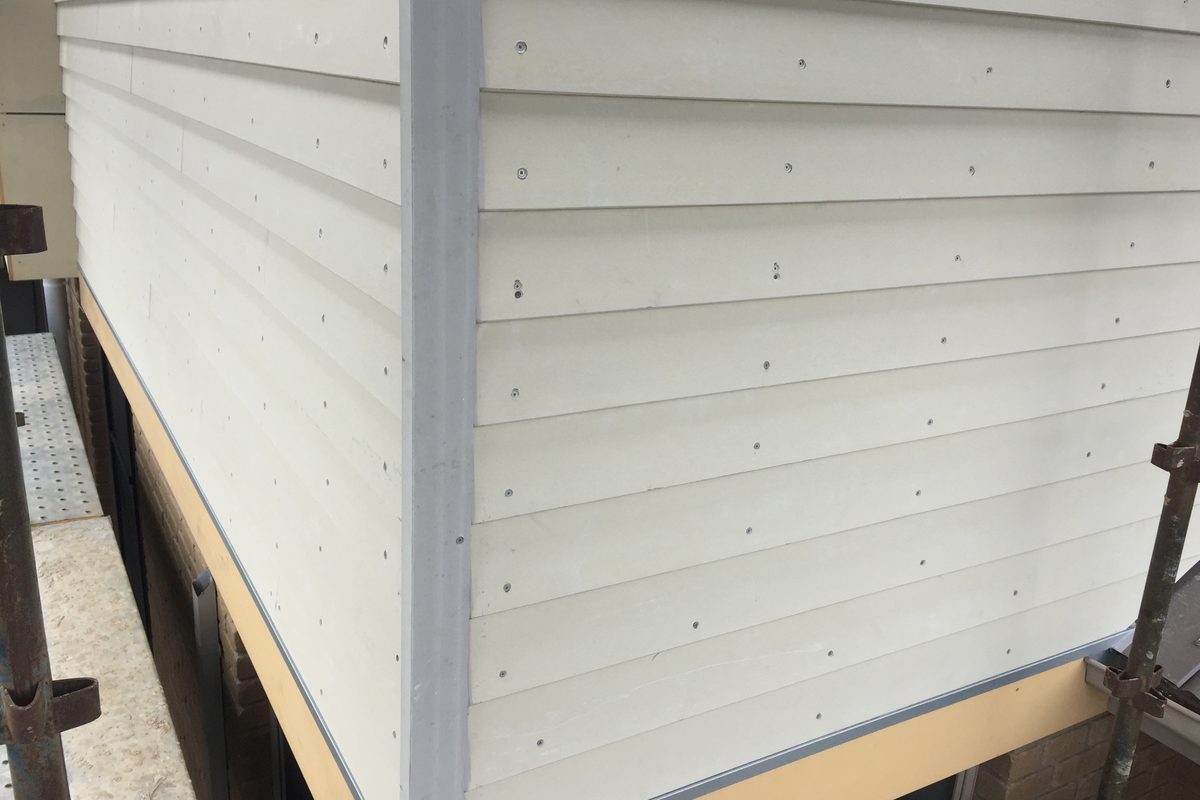 New weatherboards and corner stop, close up, before painting