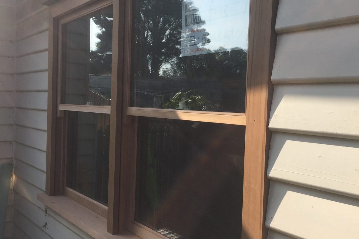New timber window in, seen from outside a weatherboard home