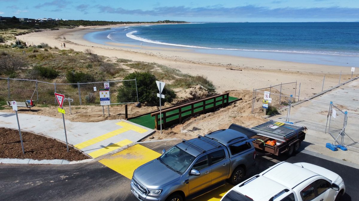 The finished beach access ramp running down through the dune to the sand